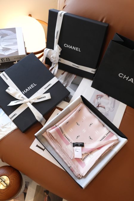 Chanel bow scarf in black and pink, 90x90cm, 100% silk. Smooth, skin-friendly, with iconic double C logo and bow jacquard design. Elegant and stylish for any occasion.