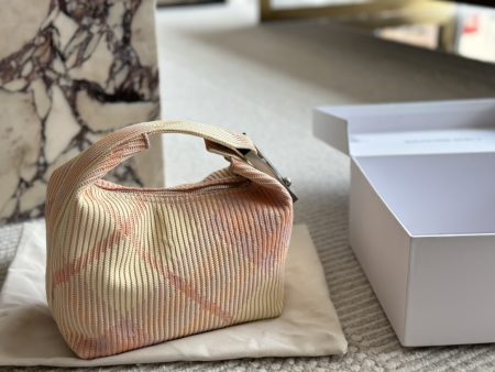 Burberry's latest Peg tote bag. Italian knit, lightweight, unlined. Features iconic check pattern and clip clasp with logo. 20cm.