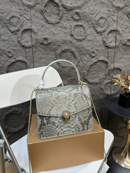 Bvlgari snake head bag with embossed leather and folding box. Recent innovations in colors and styles. Exudes luxury and elegance, compact size 20.17cm.