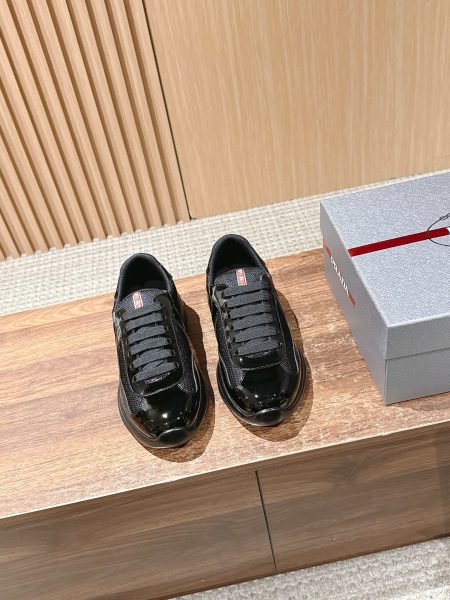Top Prada men's sneakers reissue, featuring leather, breathable Bike fabric, oversized rubber sole, and removable logo tag. Size 39-44.
