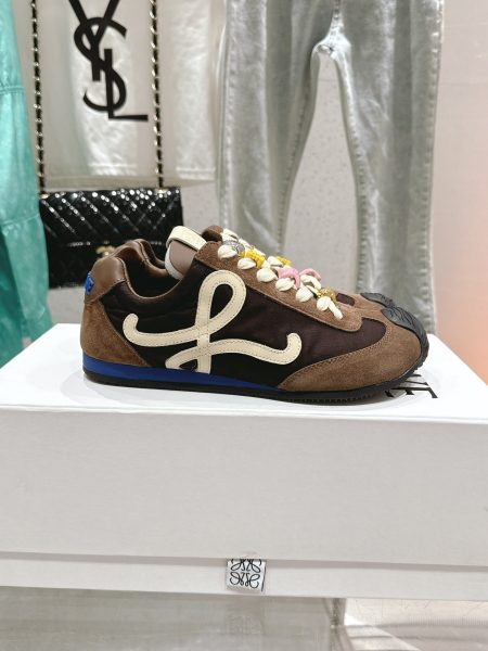 LOEWE's new Ballet Runner 2.0 sneakers feature an asymmetrical toe, soft sole, wave-textured rubber outsole, upgraded leather lining, and retro-inspired heel with 3D logo. Materials: nylon/suede and soft calfskin. Sizes: 35-45.