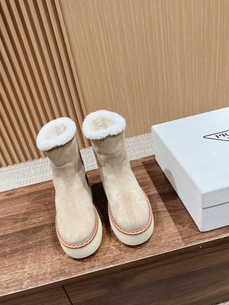 Prada winter boots with triangular logo, two-tone suede, lambswool, leather trim, sizes 35-39.