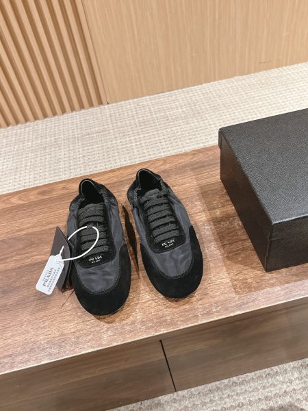 Prada women's training shoes in white. Features suede upper, lambskin lining, and TPU sole. Lightweight and comfortable. Sizes 35-41.