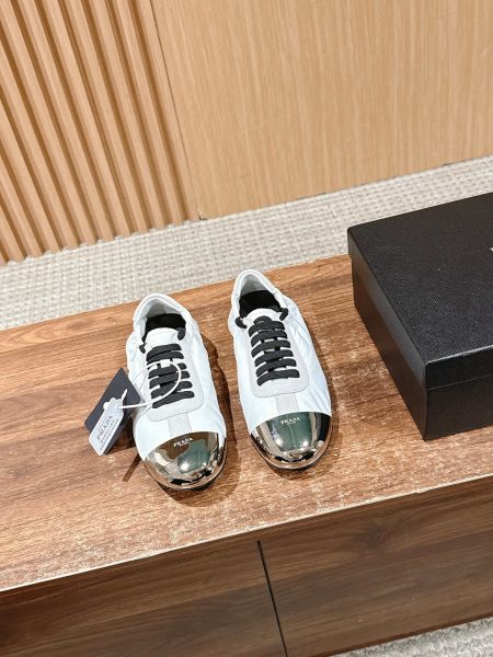 Prada new metal toe low-profile training shoes. Upper: suede/fabric. Lining: lambskin. Sole: TPU. Sizes 35-41. Lightweight, comfortable, stylish.