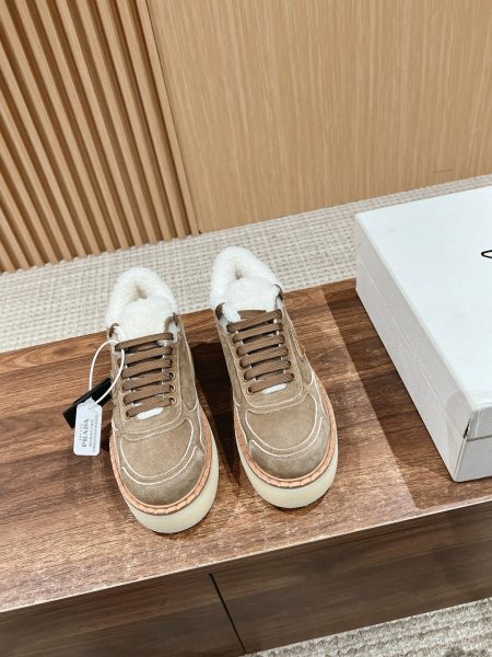 Prada autumn-winter lace-up boots with triangular logo, two-tone suede, genuine lambswool, and leather trim. Sizes 35-39.