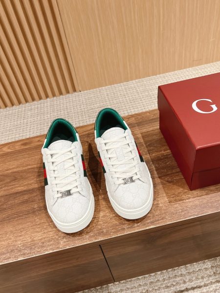 Gucci Ace sneakers, new low-top design with metallic logo and signature stripe. Genuine leather, slip-resistant sole. Unisex sizes available.