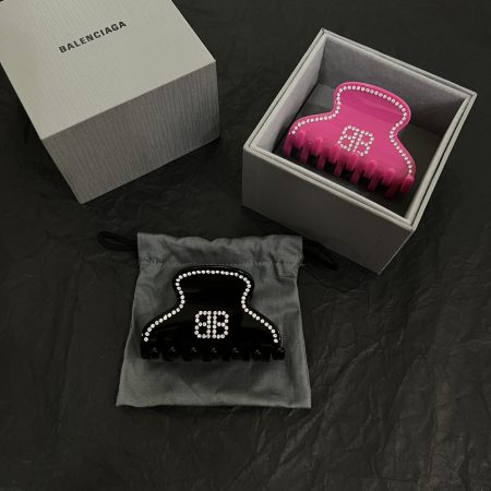Balenciaga new hair clip, simple and elegant design with golden finish, perfect for outfit pairing.