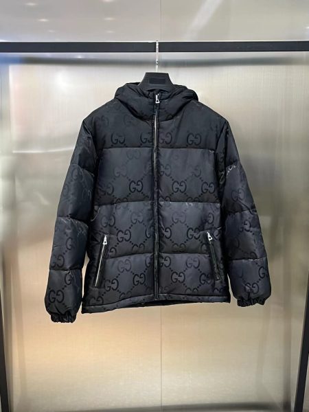 Gucci GG logo hooded down jacket in black and green. Sizes: 42-50.