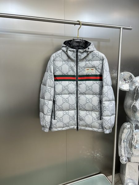 Gucci classic bicolor stand-collar down jacket, unisex design. Made with imported tech fabric, windproof and water-resistant. Features GG stripe pattern, 90% goose down filling for warmth. Stand collar, ribbed cuffs, zip and snap closure. Available in sizes M-3XL.
