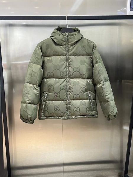 Gucci GG logo hooded down jacket in black and green. Sizes: 42-50.