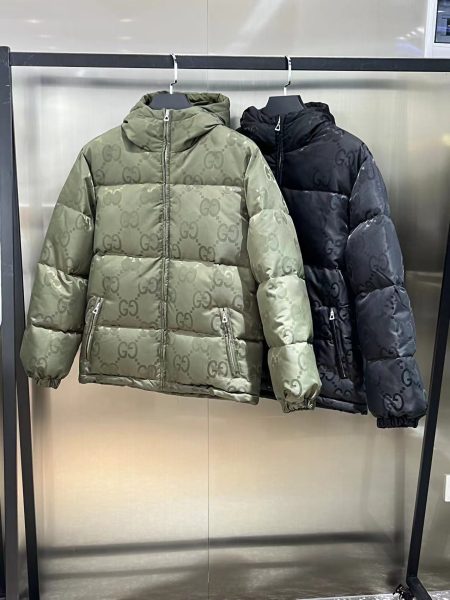 Gucci GG logo hooded down jacket in black and green. Sizes: 42-50.